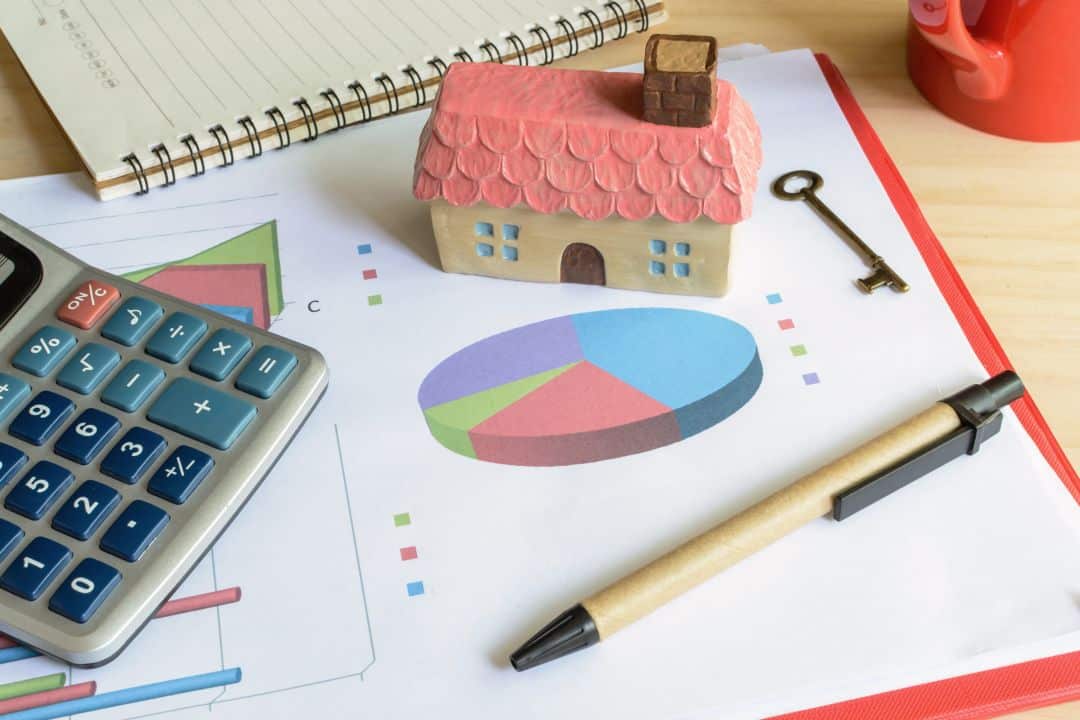 Financial planning documents and investment analysis charts showing development finance and ROI modeling for mixed-use projects