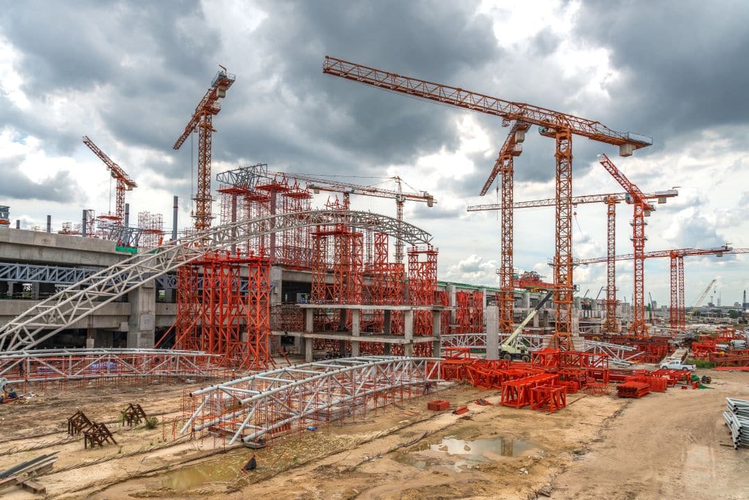 Industrial building construction and development showing modern warehouse construction techniques for logistics facility development