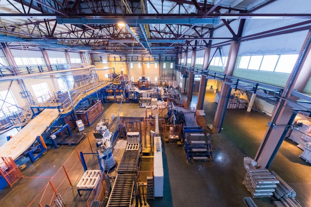 Industrial manufacturing facility showing infrastructure and location requirements for different business sectors in economic development site selection
