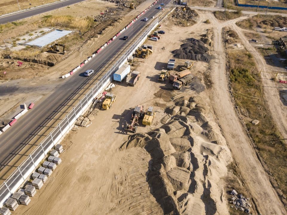 Infrastructure construction and utility development showing electrical systems and site preparation for economic development projects