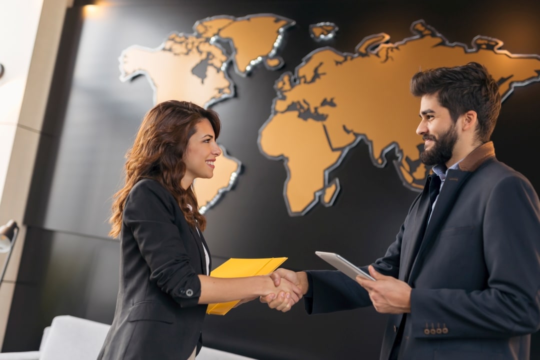 Business professionals collaborating on international EB-5 investor attraction and marketing strategies for immigration investment programs
