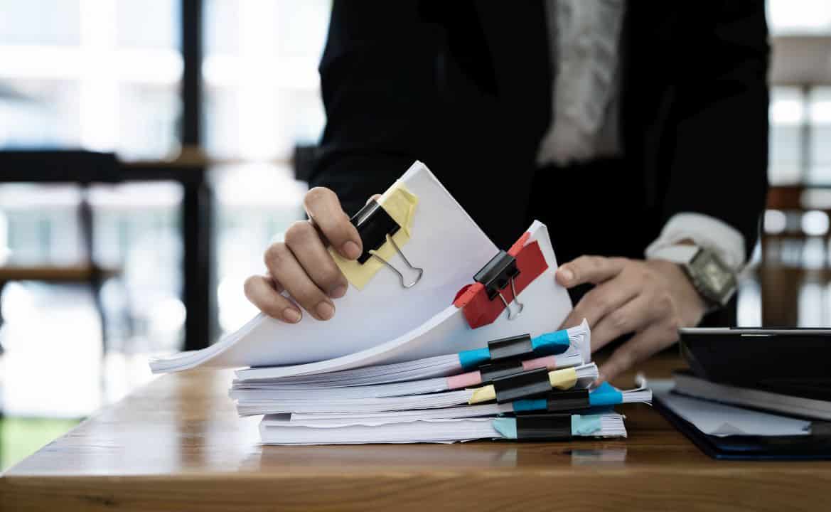 Legal documents and contract analysis representing regulatory compliance and risk allocation strategies in economic development partnerships