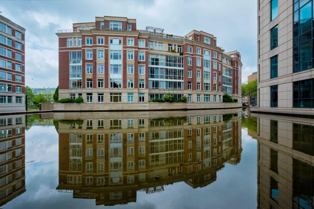 Contemporary mixed-use development building showing integrated residential and commercial spaces representing strategic development project planning