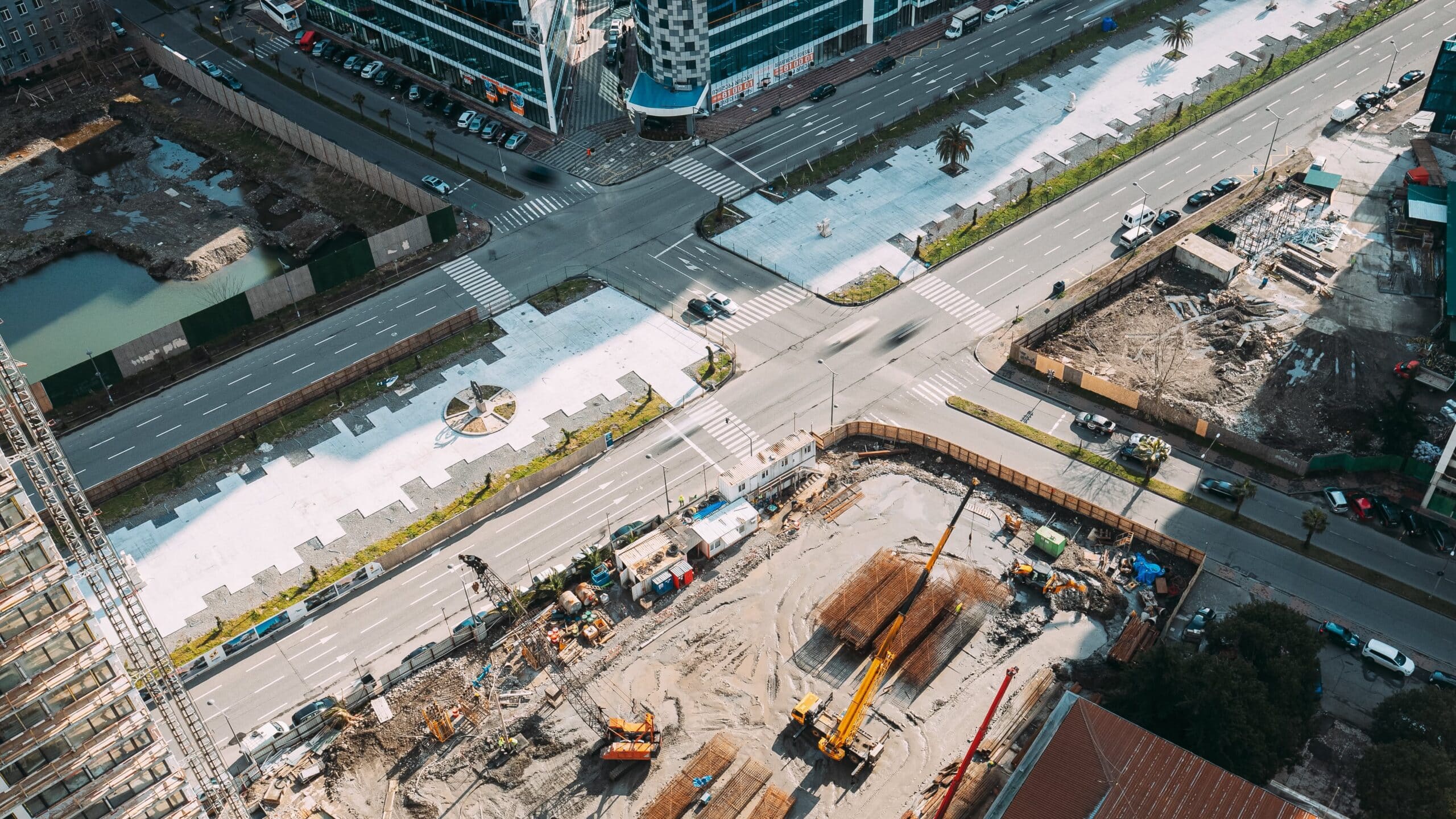 Large-scale infrastructure construction project showing project management coordination and development execution for complex infrastructure projects